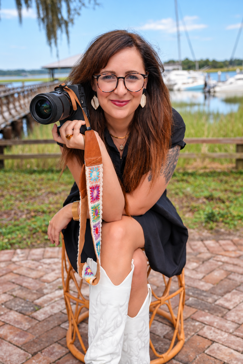 Liesl Webber with her camera beside a Savannah marina